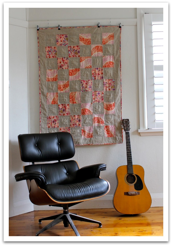 tan and red quilt